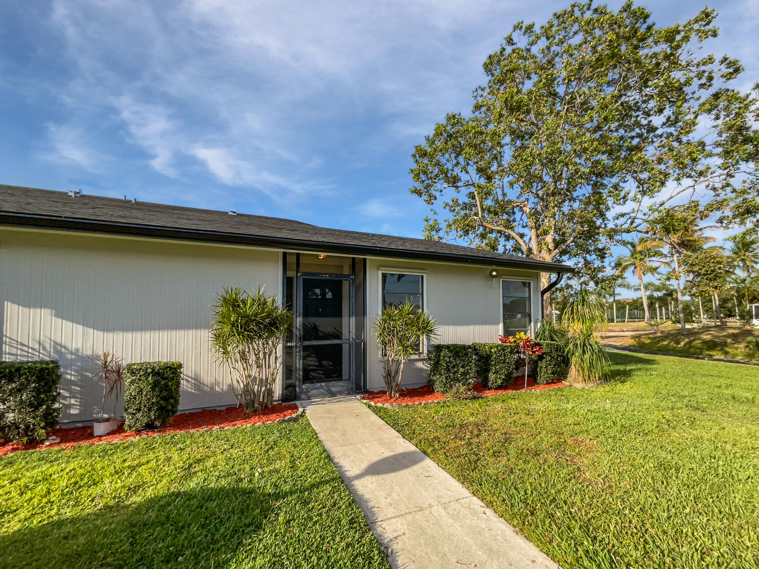 4249 Willow Pond Circle West Palm Beach, FL 33417 - Photo 12 of 30 a house view with a garden space