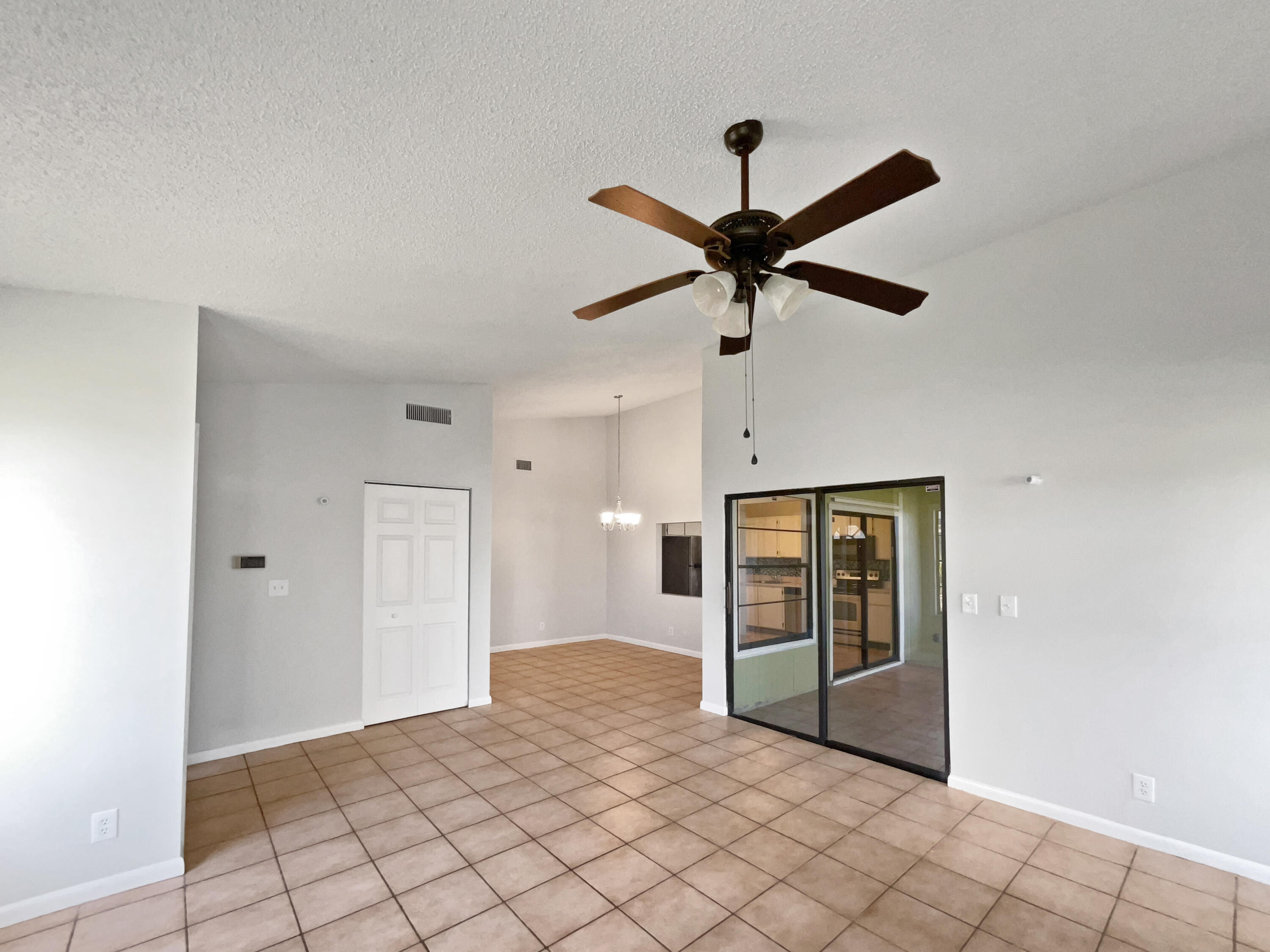 4249 Willow Pond Circle West Palm Beach, FL 33417 - Photo 13 of 30 a view of a livingroom with a ceiling fan and window