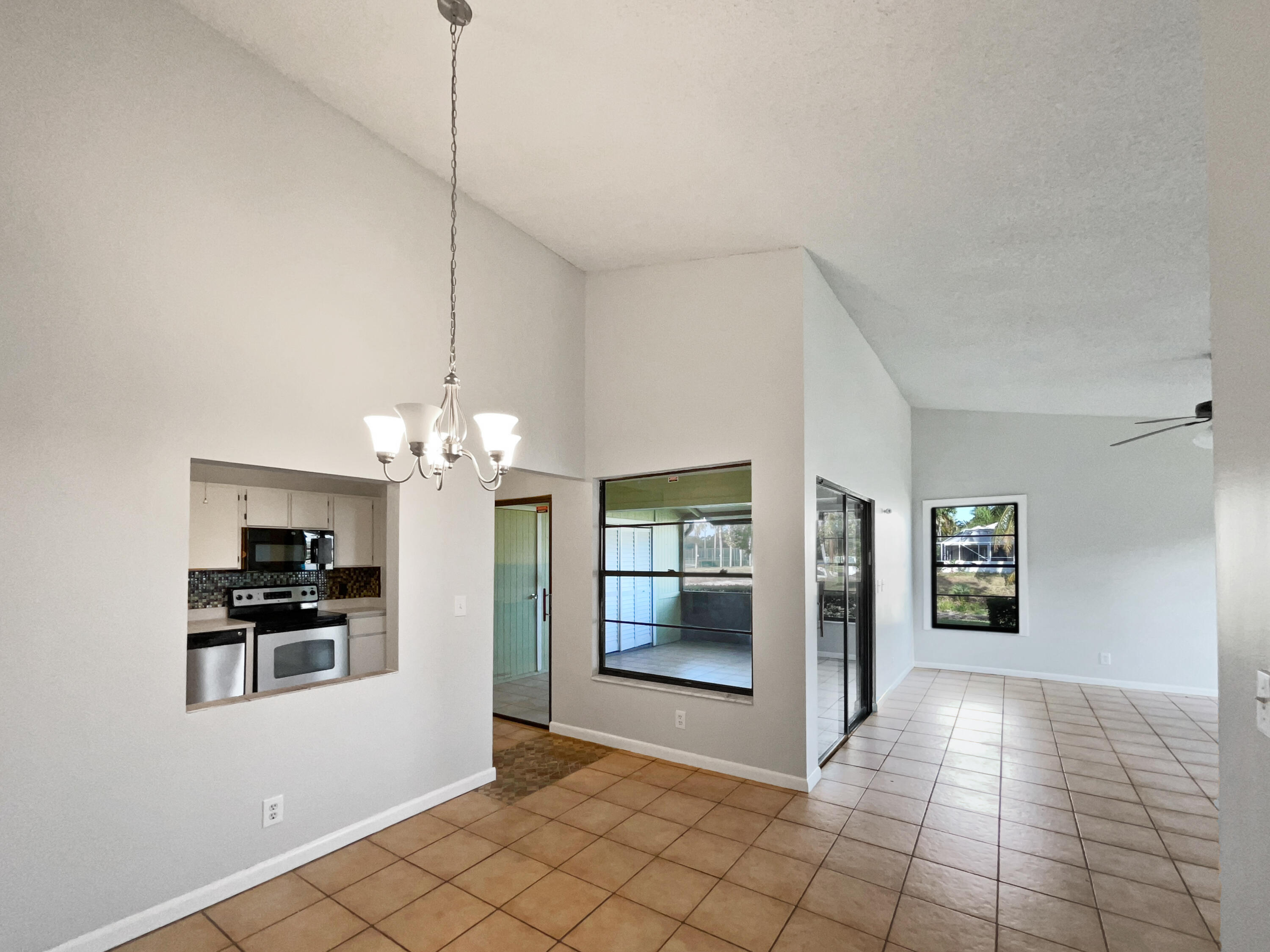 4249 Willow Pond Circle West Palm Beach, FL 33417 - Photo 14 of 30 a view of a kitchen with an empty space and kitchen view