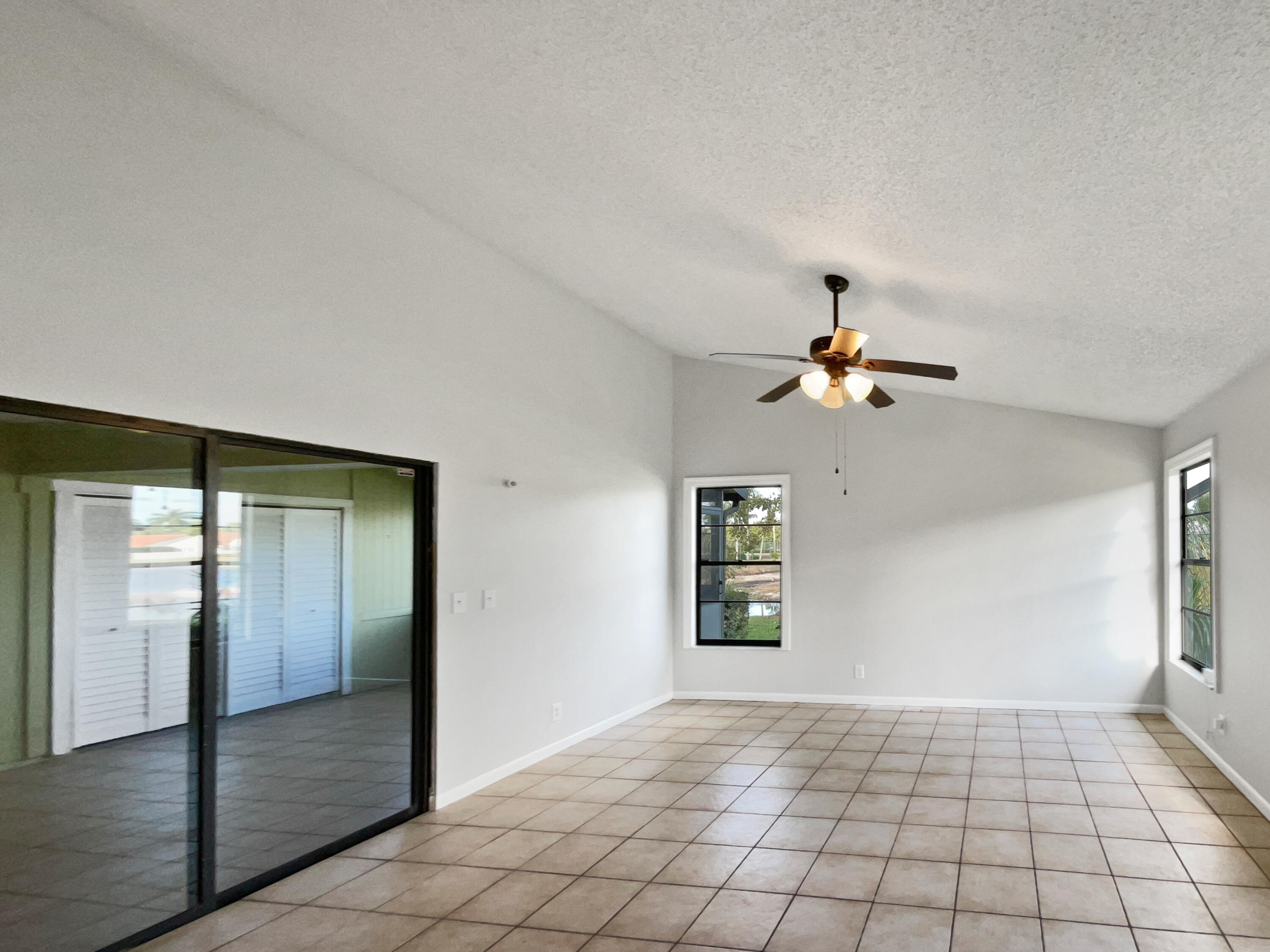 4249 Willow Pond Circle West Palm Beach, FL 33417 - Photo 19 of 30 a view of an empty room and window