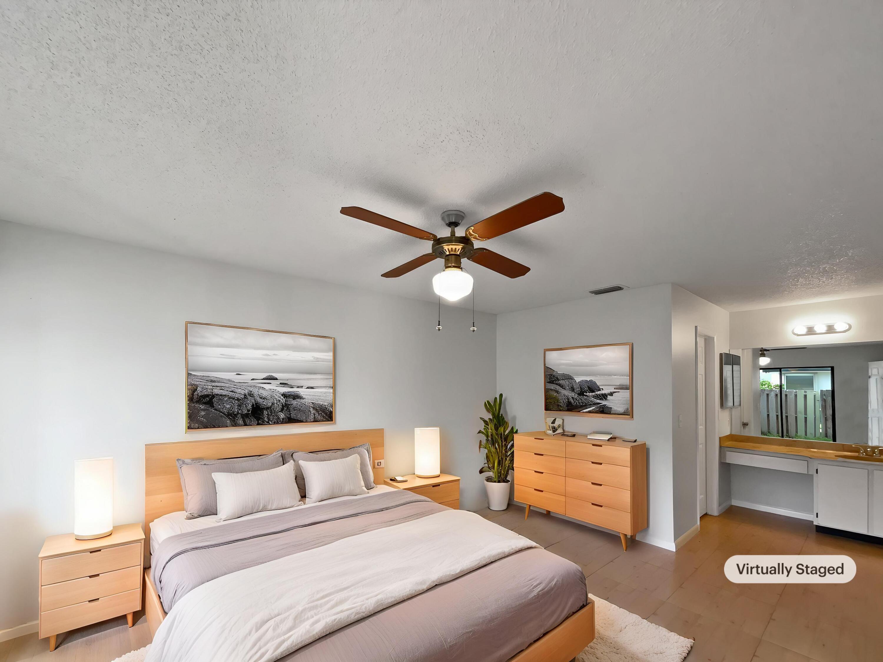 4249 Willow Pond Circle West Palm Beach, FL 33417 - Photo 4 of 30 a bedroom with a bed and furniture