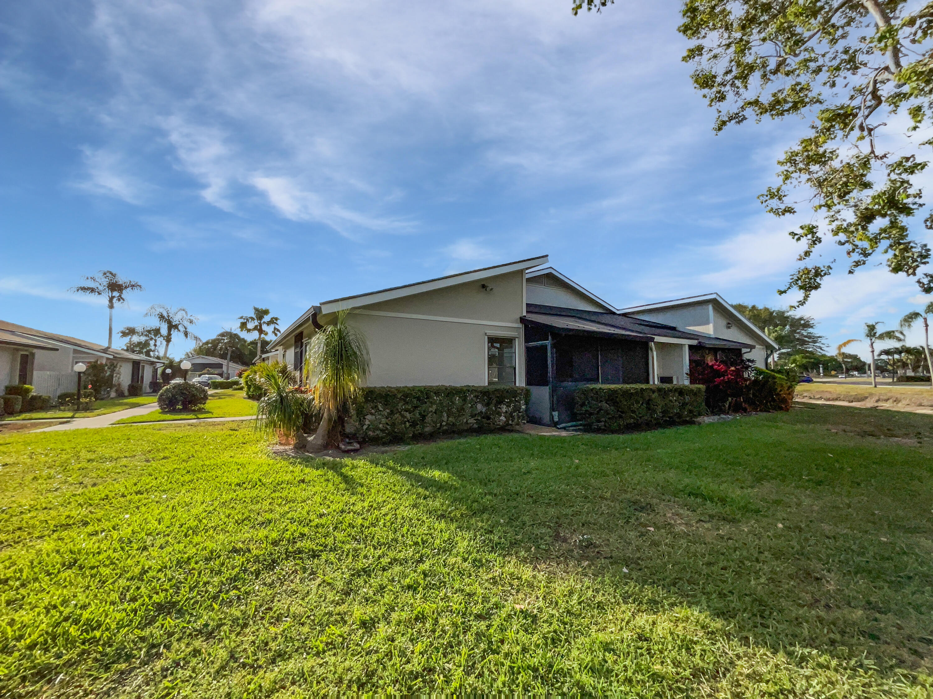 4249 Willow Pond Circle West Palm Beach, FL 33417 - Photo 8 of 30 a front view of a house with garden