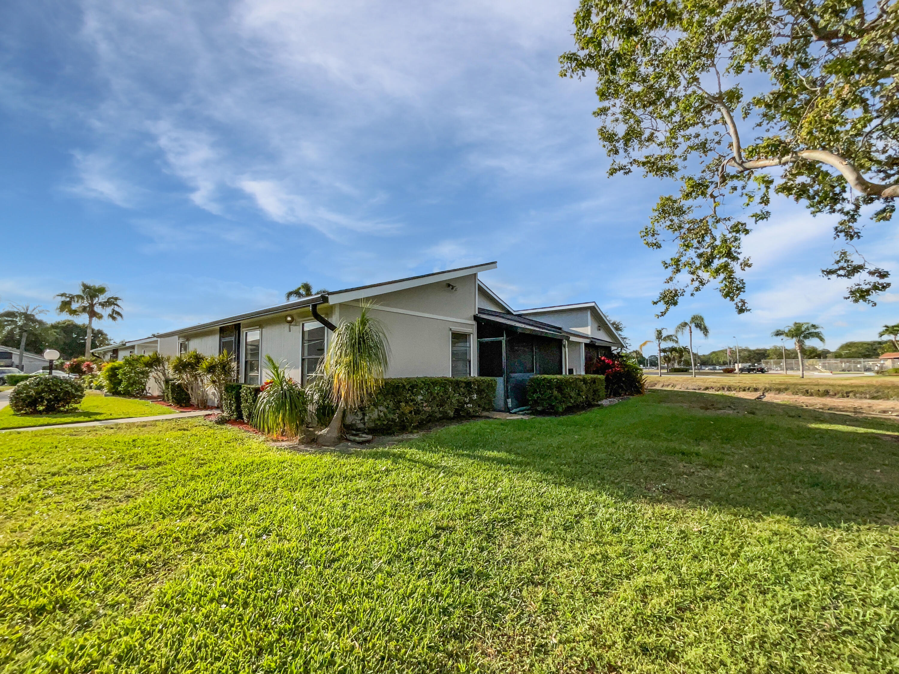4249 Willow Pond Circle West Palm Beach, FL 33417 - Photo 9 of 30 a view of a house with a big yard