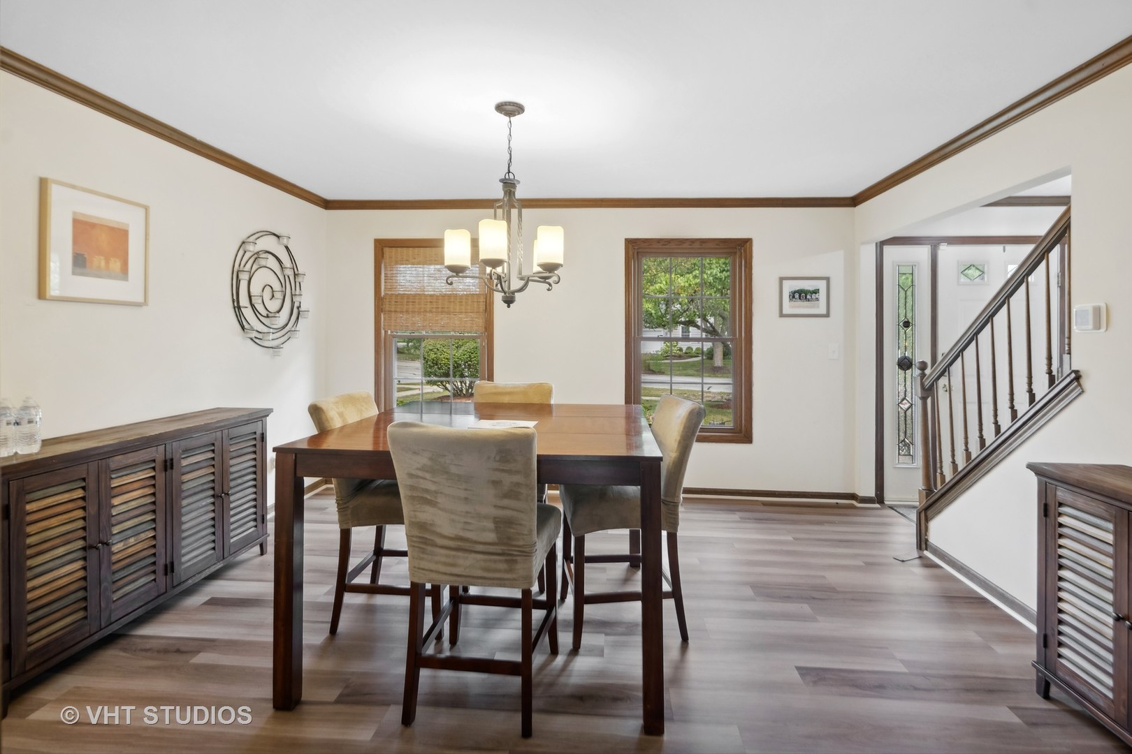 718 Raintree Drive Naperville, IL 60540 - Photo 11 of 41 a view of a dining room with furniture window and wooden floor