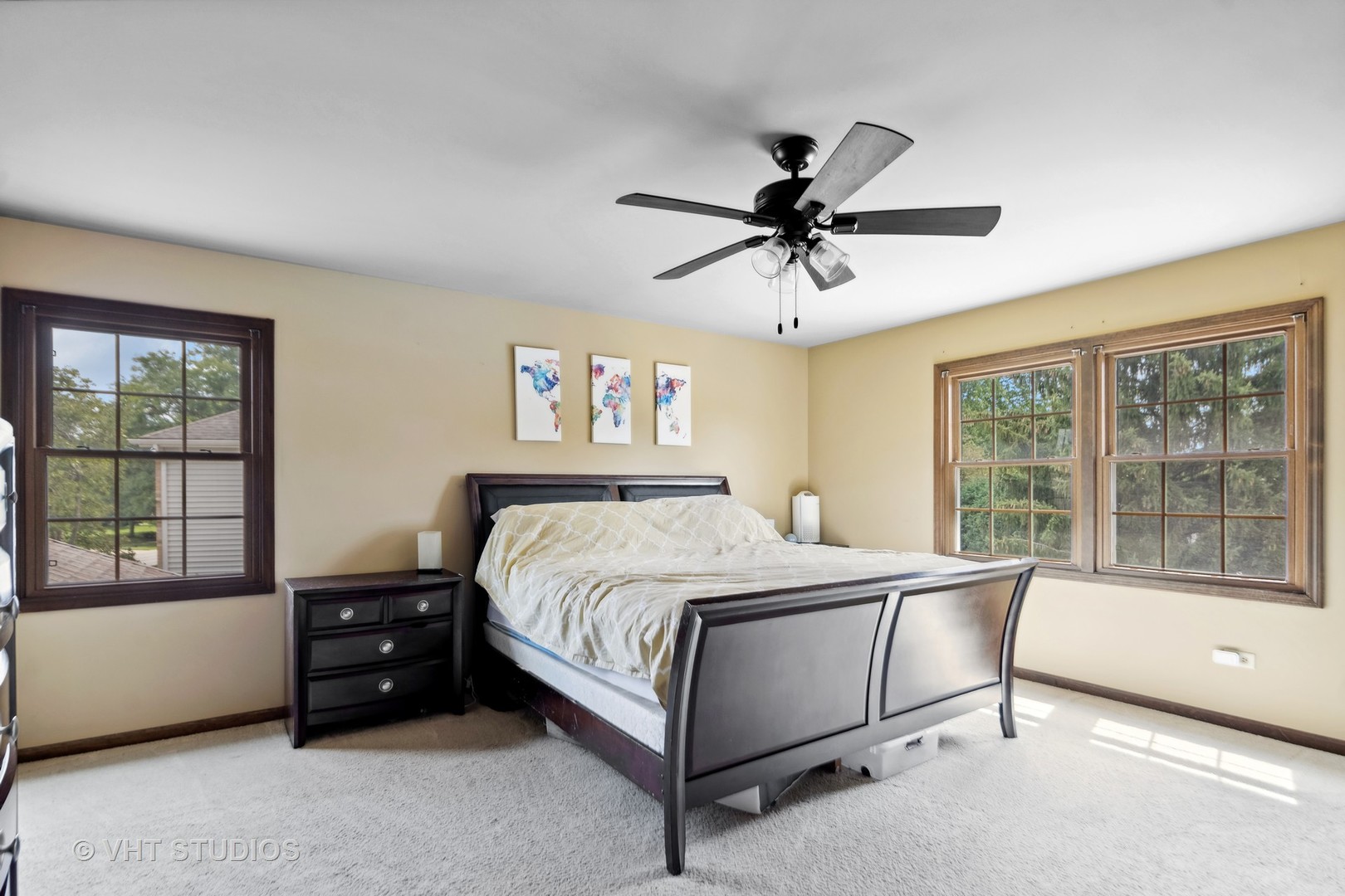 718 Raintree Drive Naperville, IL 60540 - Photo 23 of 41 a bedroom with a large bed and a ceiling fan