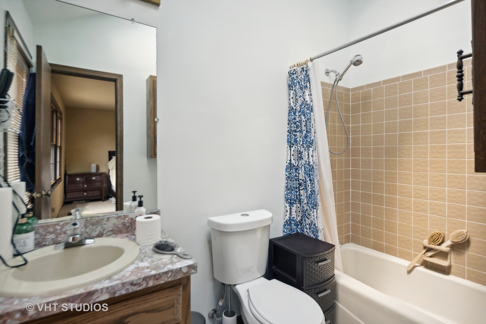 718 Raintree Drive Naperville, IL 60540 - Photo 25 of 41 a bathroom with a granite countertop toilet a sink and a bathtub