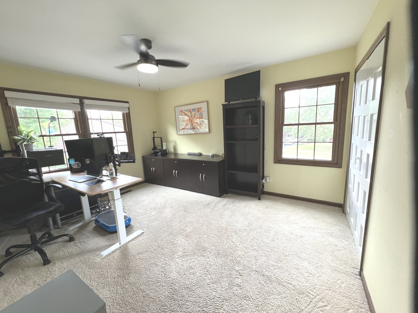 718 Raintree Drive Naperville, IL 60540 - Photo 30 of 41 a view of a livingroom with workspace and a window