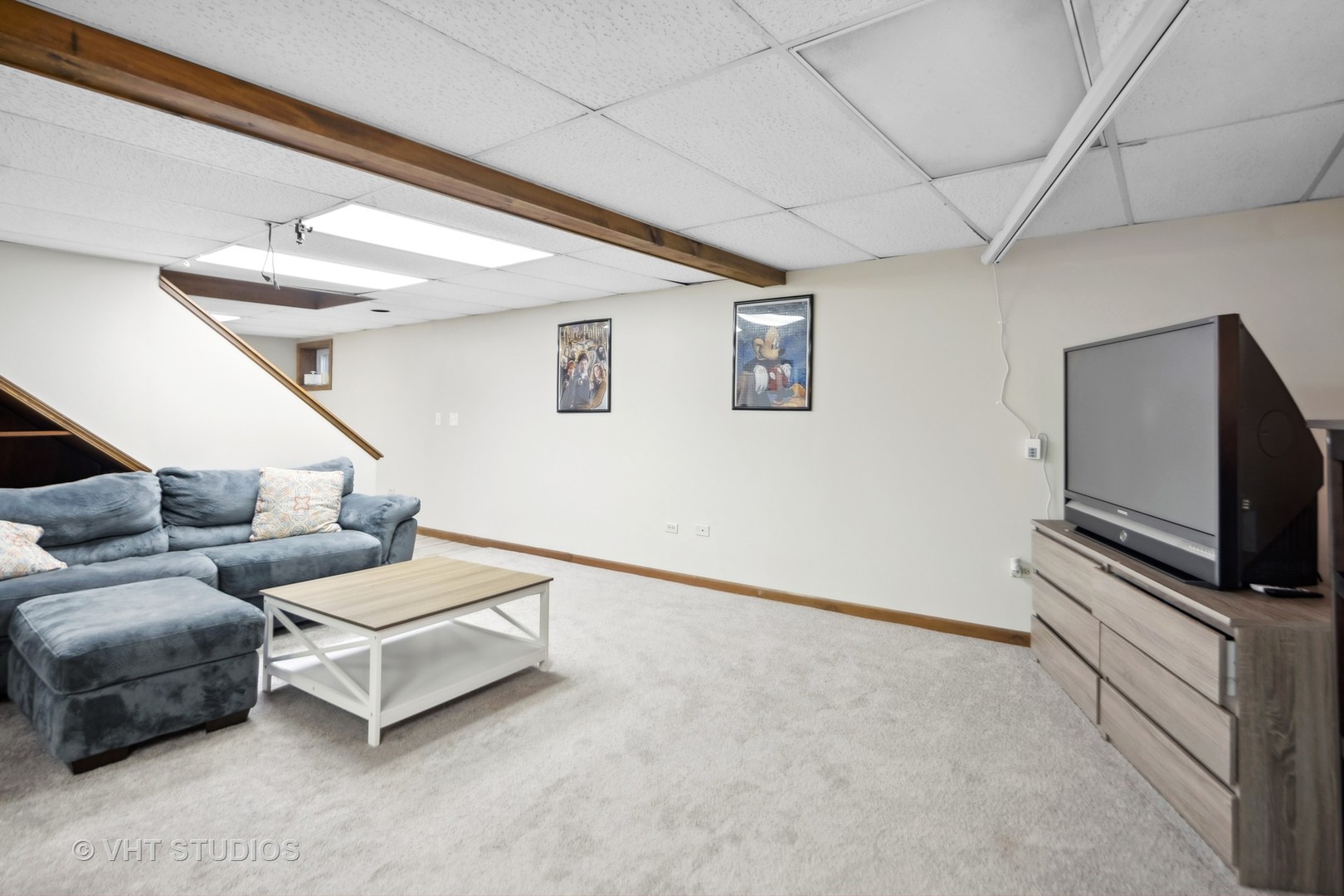 718 Raintree Drive Naperville, IL 60540 - Photo 36 of 41 a living room with furniture and a flat screen tv