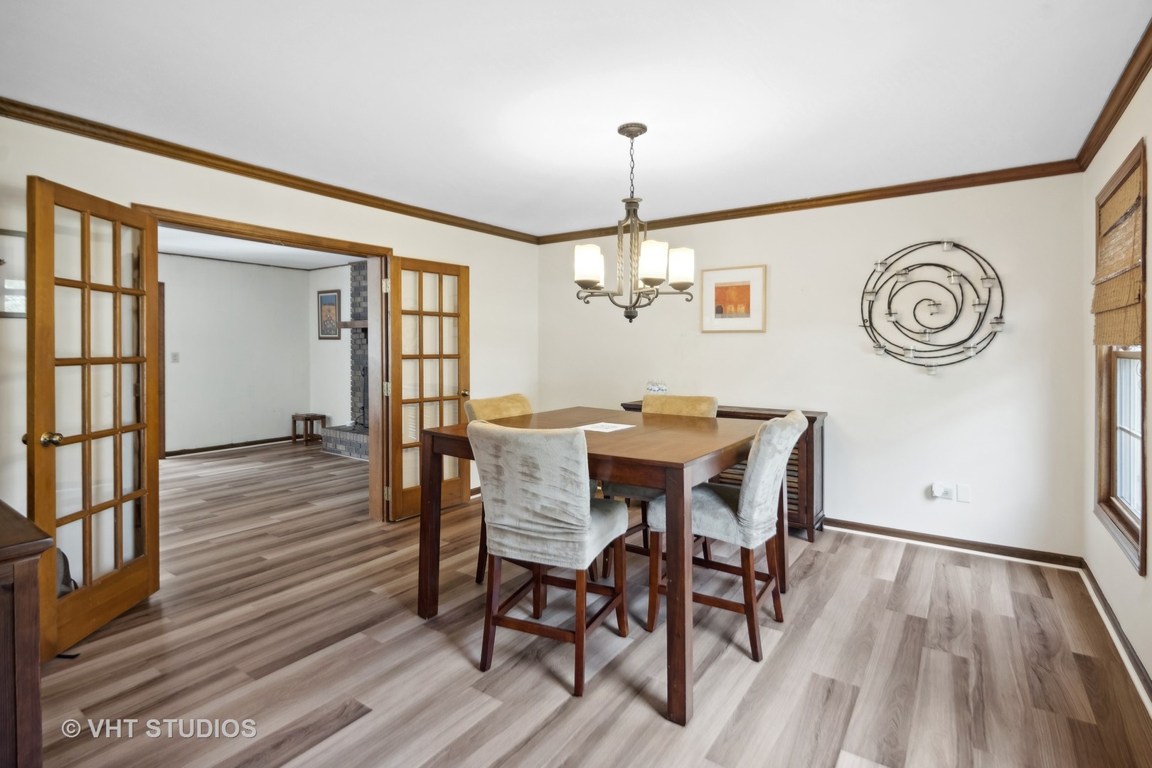 718 Raintree Drive Naperville, IL 60540 - Photo 8 of 41 a view of a dining room with furniture window and wooden floor