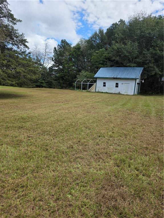 5491 Bold Springs Road Dacula, GA 30019 - Photo 2 of 28 a view of a house with a yard
