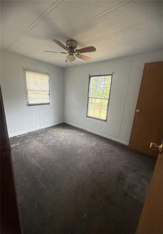 5491 Bold Springs Road Dacula, GA 30019 - Photo 23 of 28 an empty room with windows and fan