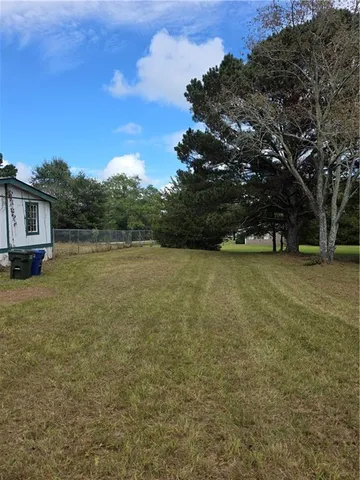 a view of yard with outdoor seating