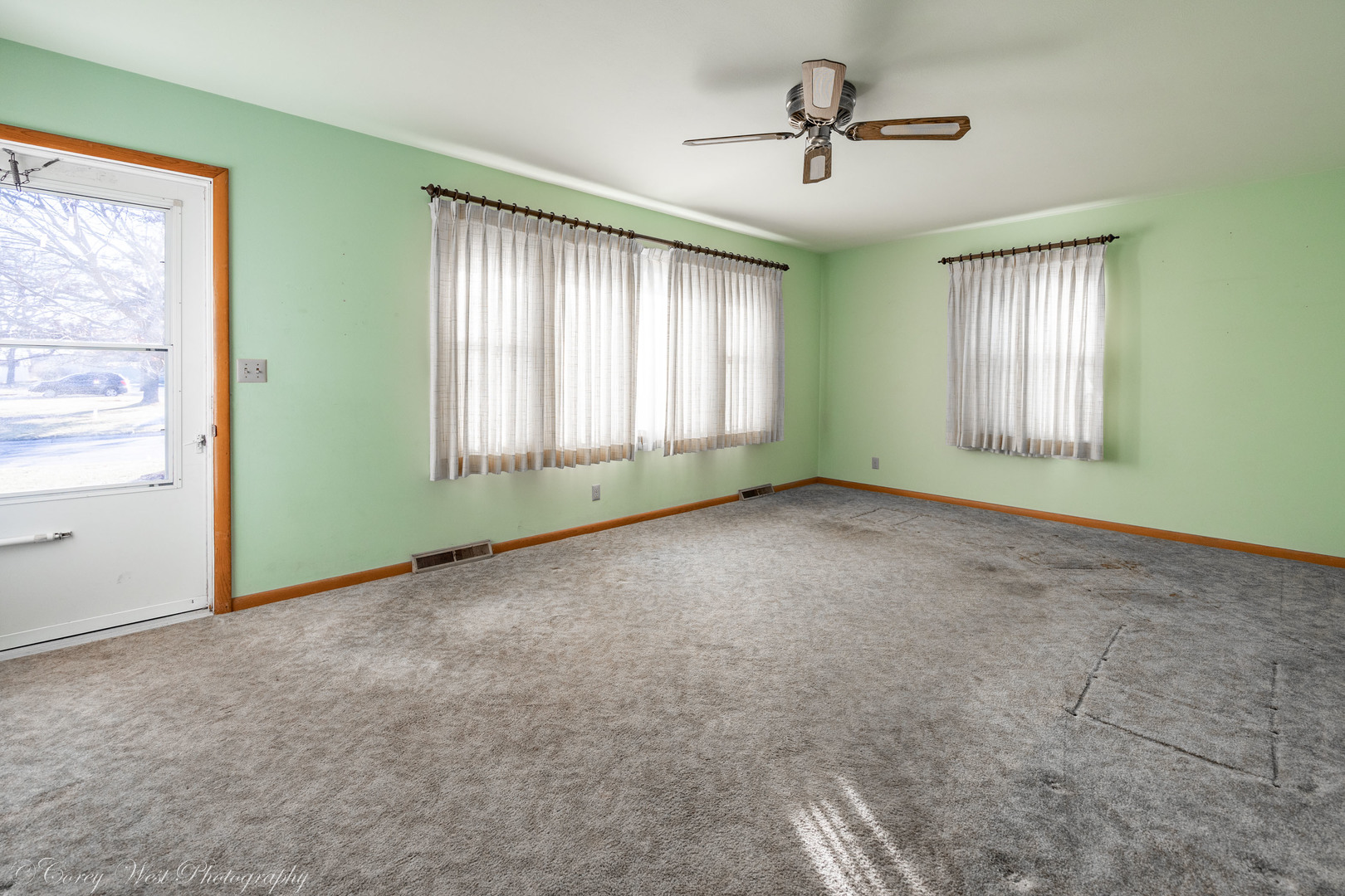 219 Reid Road Genoa, IL 60135 - Photo 6 of 23 a view of an empty room with a window