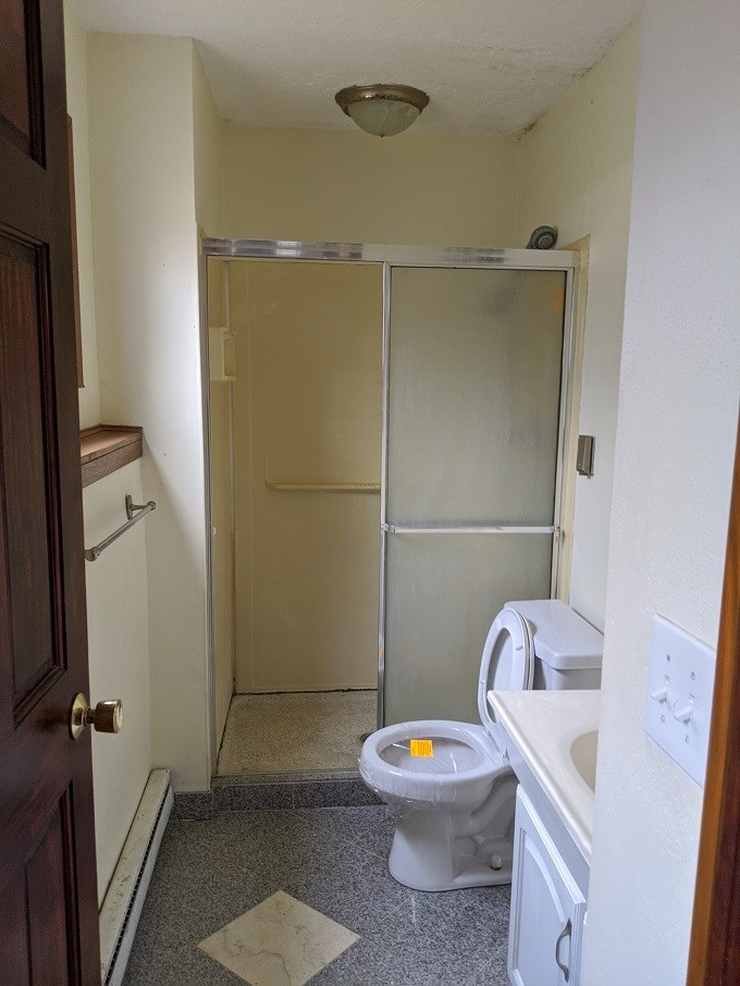 620 Lake Summerset Road Davis, IL 61019 - Photo 11 of 15 a white toilet sitting next to a bathroom sink and a shower