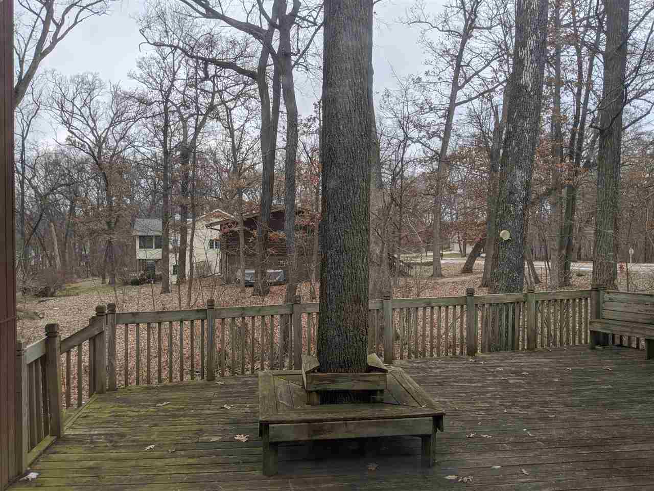 620 Lake Summerset Road Davis, IL 61019 - Photo 14 of 15 a view of a wooden deck with trees