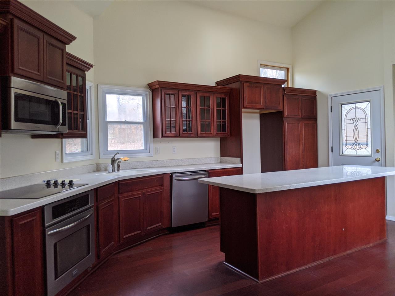 620 Lake Summerset Road Davis, IL 61019 - Photo 3 of 15 a kitchen with stainless steel appliances granite countertop wooden cabinets a stove top oven a sink and dishwasher