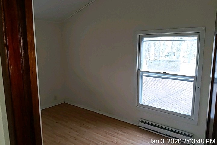 620 Lake Summerset Road Davis, IL 61019 - Photo 8 of 15 a view of an empty room with wooden floor and a window
