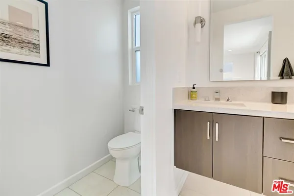 a bathroom with a sink toilet and vanity