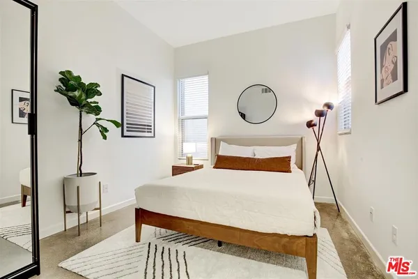 a bedroom with a large bed and a table