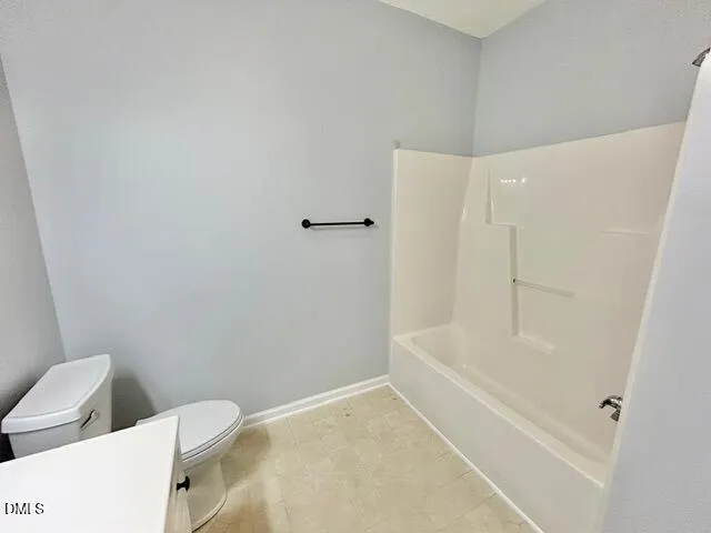 a bathroom with a bathtub and toilet