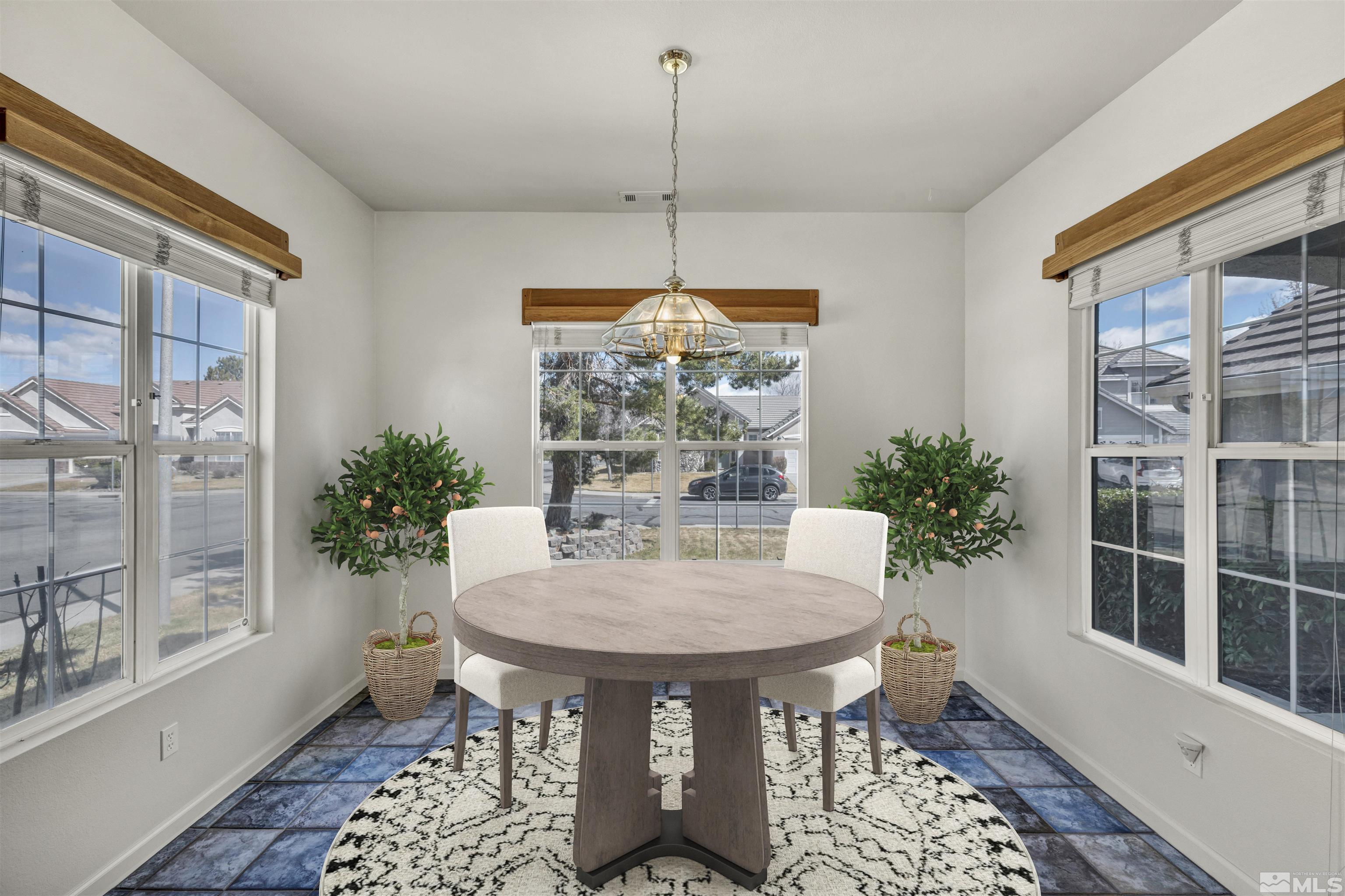 9705 Rolling Rock Court Reno, NV 89521 - Photo 5 of 19 a view of a dining room with furniture window and wooden floor