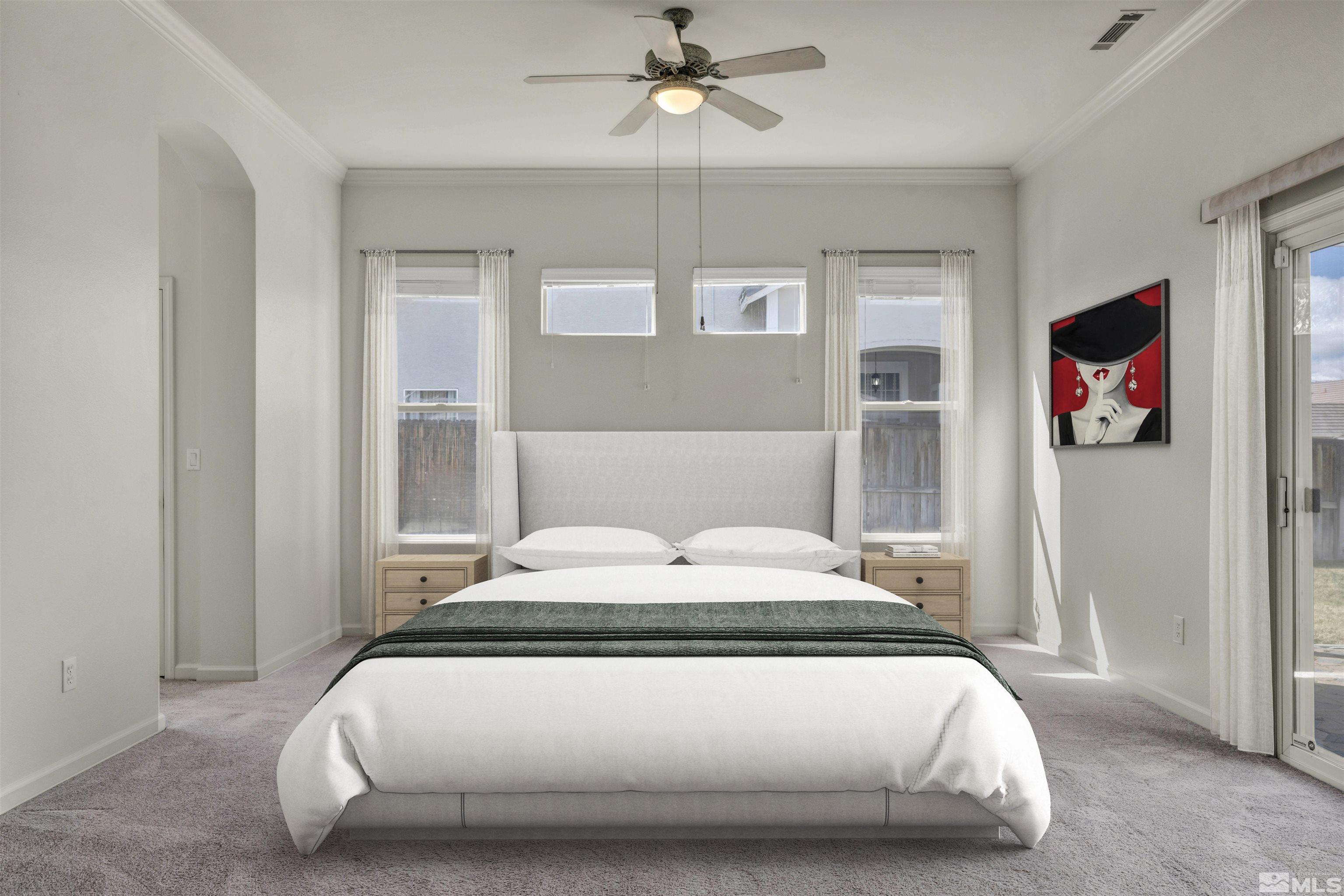 9705 Rolling Rock Court Reno, NV 89521 - Photo 7 of 19 a bedroom with a bed and a chandelier