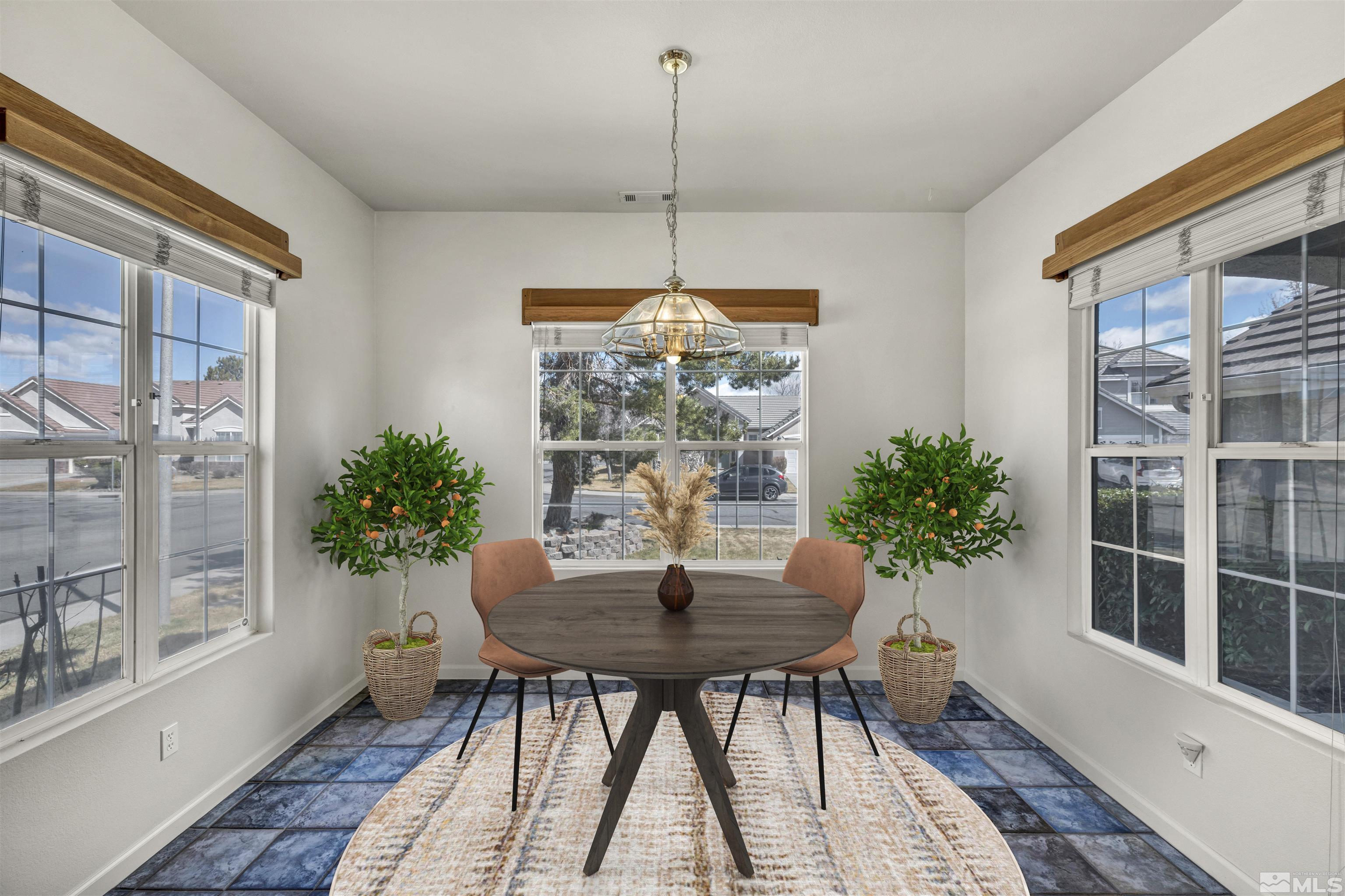 9705 Rolling Rock Court Reno, NV 89521 - Photo 8 of 19 a dining room with furniture window and wooden floor