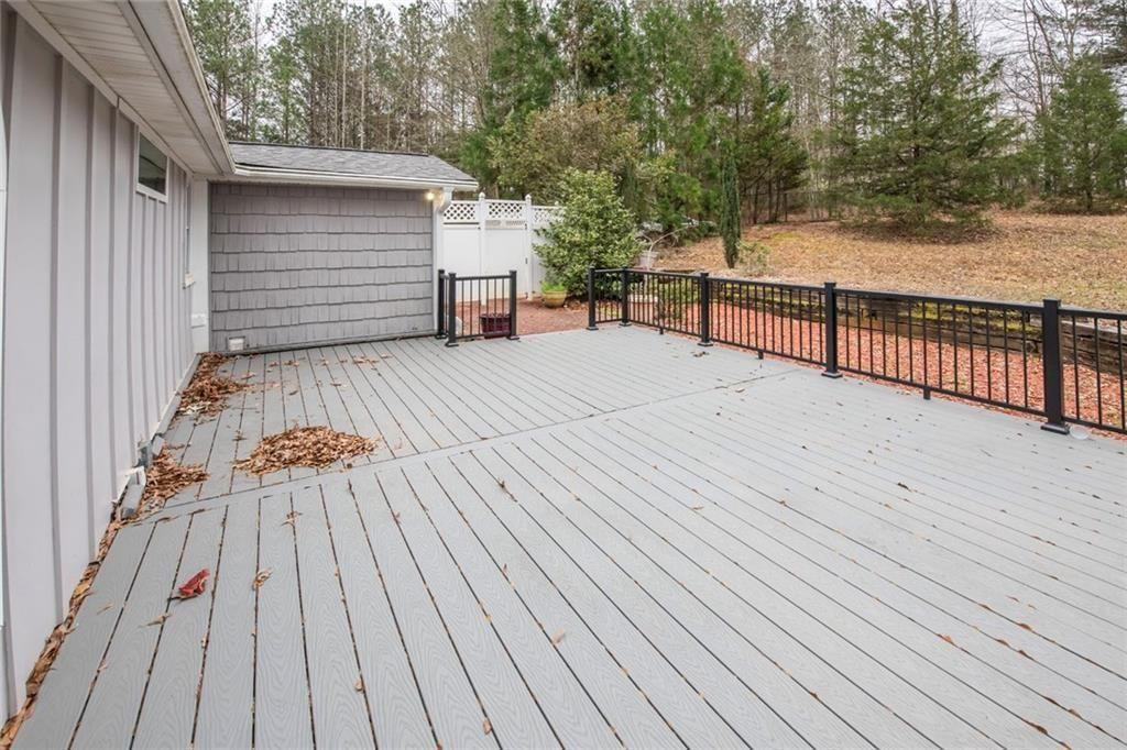 3819 Mason Creek Road Winston, GA 30187 - Photo 43 of 54 a view of backyard with a deck and wooden floor