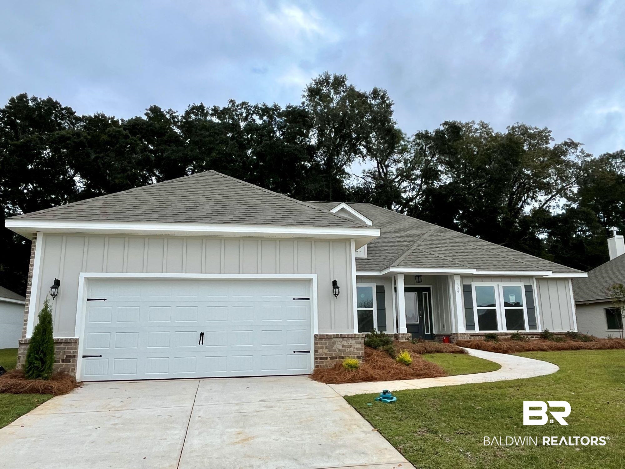 334 Barndling Street Fairhope, AL 36532 - Photo 4 of 34 View of front of home featuring a garage and a front yard