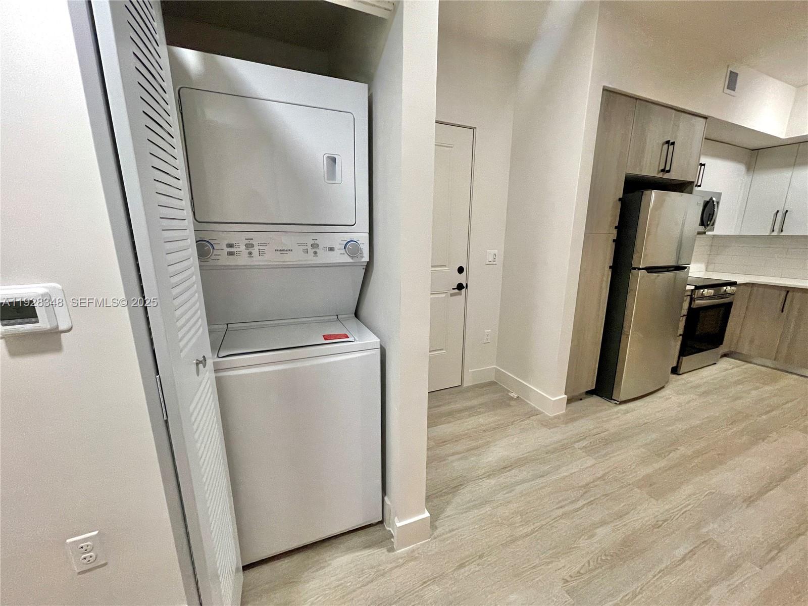 18412 Homestead Avenue, Unit 124 Miami, FL 33157 - Photo 11 of 20 a view of a storage and utility room with washer and dryer