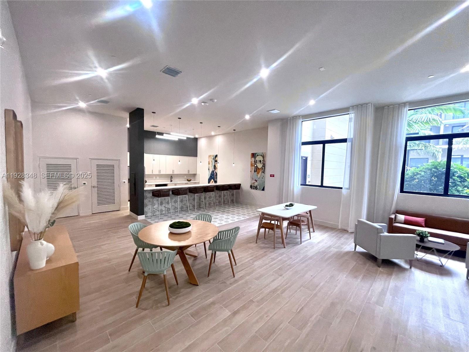18412 Homestead Avenue, Unit 124 Miami, FL 33157 - Photo 17 of 20 a living room with furniture and a wooden floor