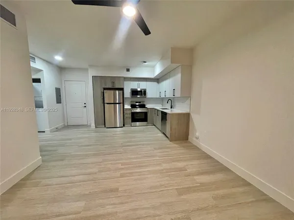 a view of a kitchen with a sink