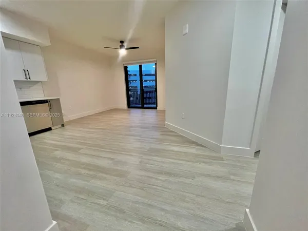a view of empty room with a fireplace
