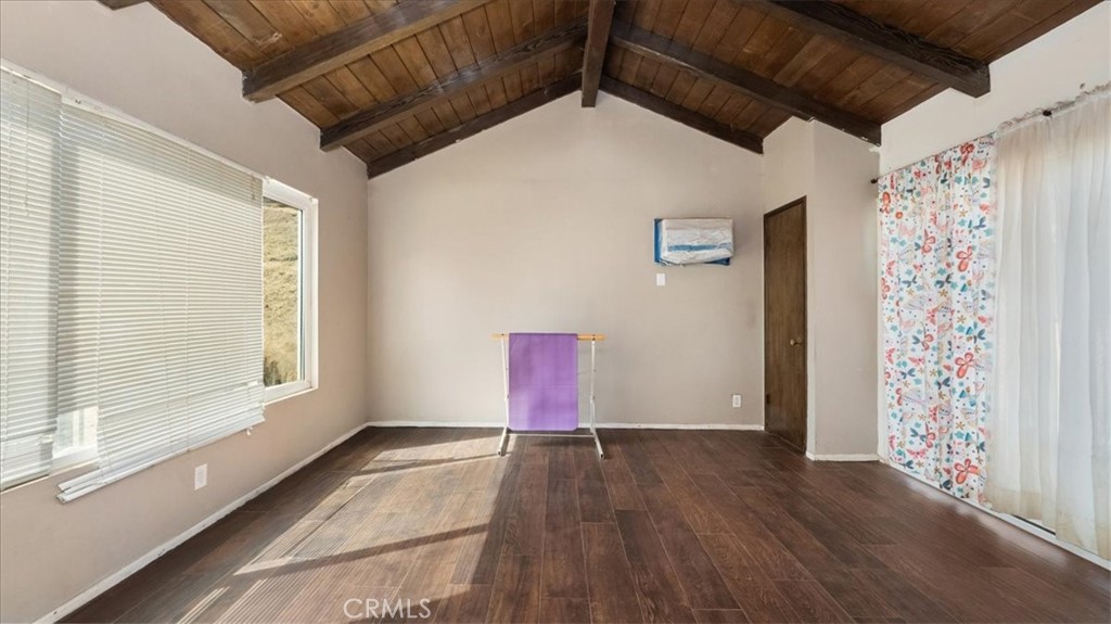 4440 Daniel Drive Riverside, CA 92503 - Photo 12 of 20 a view of an empty room with wooden floor and a window