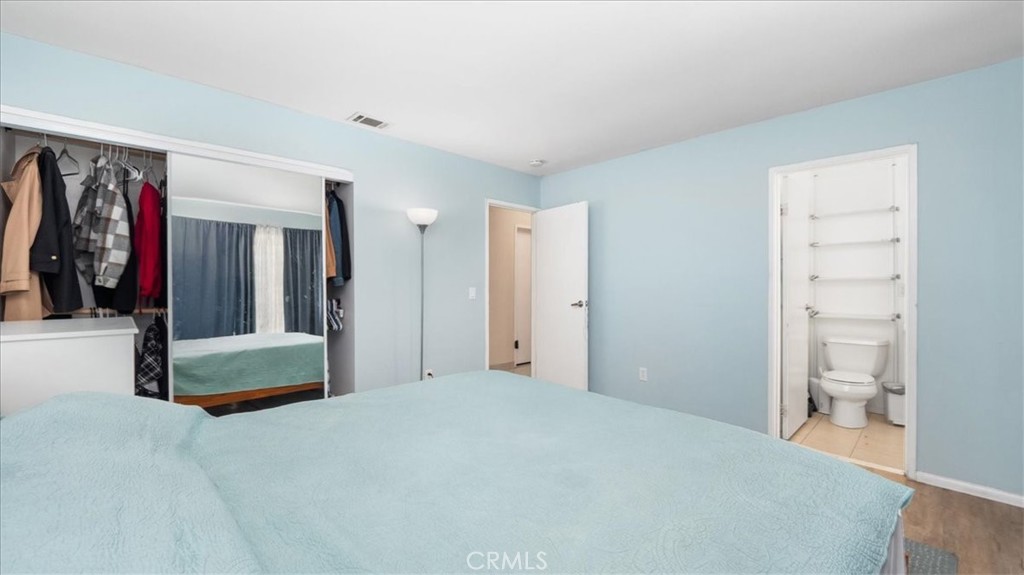 4440 Daniel Drive Riverside, CA 92503 - Photo 15 of 20 a bedroom with a bed and a mirror