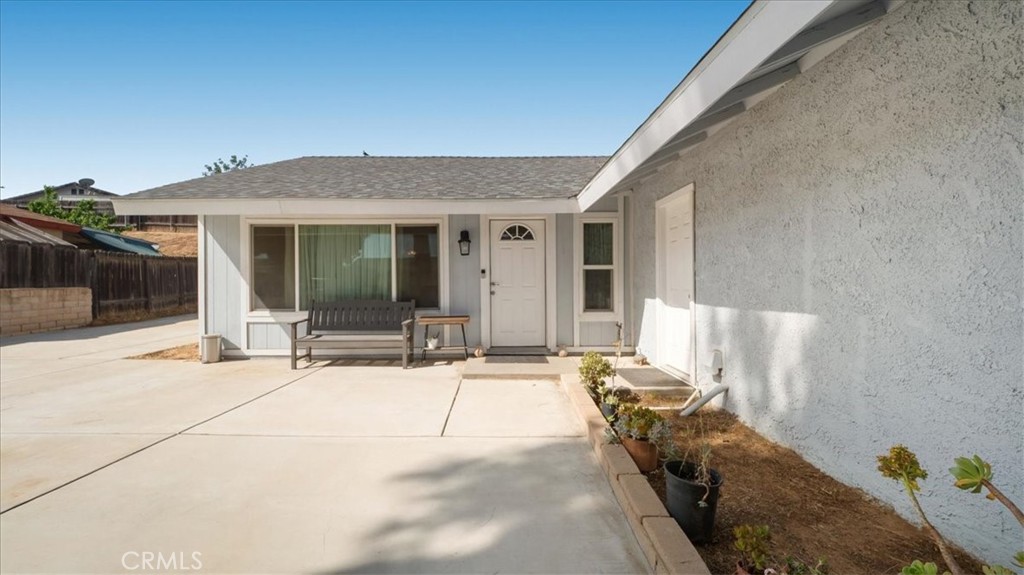 4440 Daniel Drive Riverside, CA 92503 - Photo 4 of 20 a view of a house with floor to ceiling windows and a basket ball poll