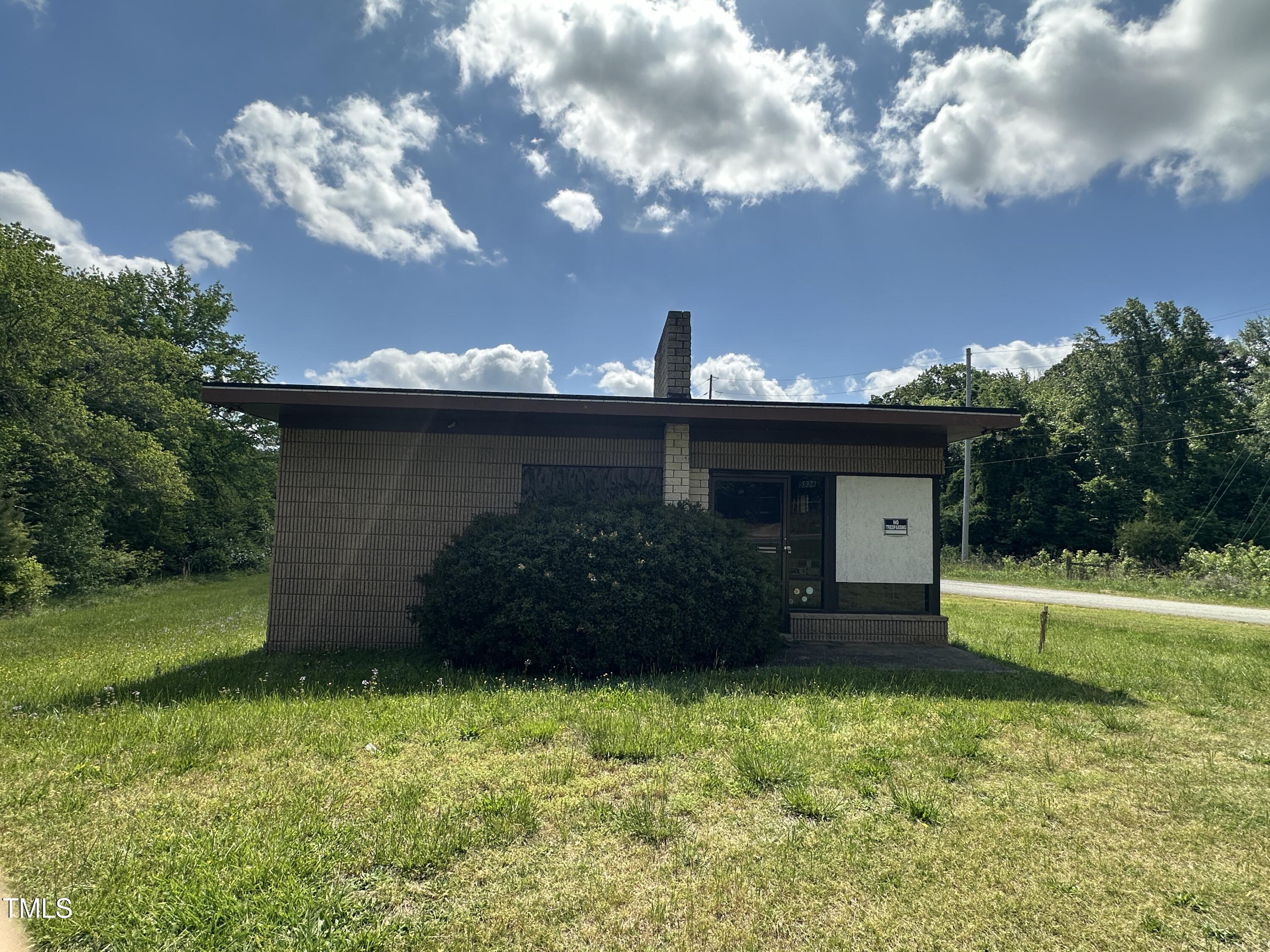 5934 Boston Road Roxboro, NC 27574 - Photo 4 of 5 a view of a garden with a large tree