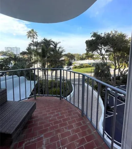 a view of balcony with furniture