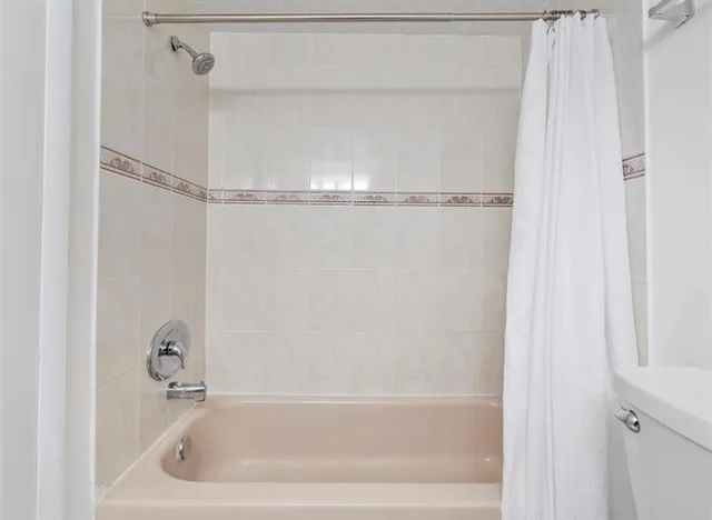 a close view of a bathtub in bathroom