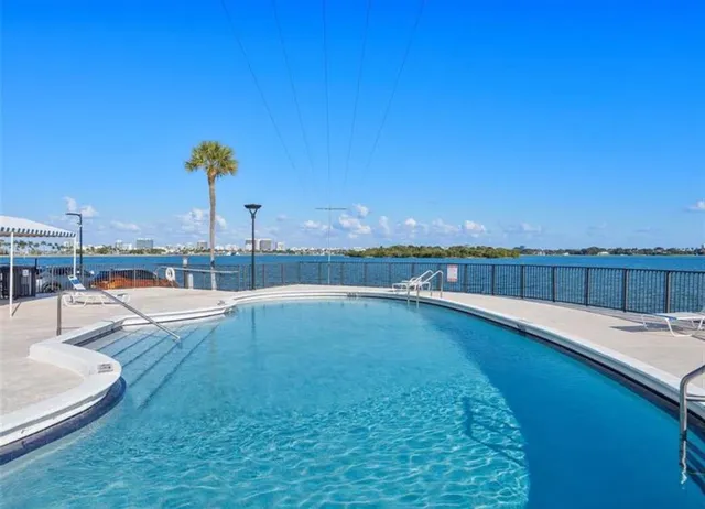 a view of a terrace with a table and chairs