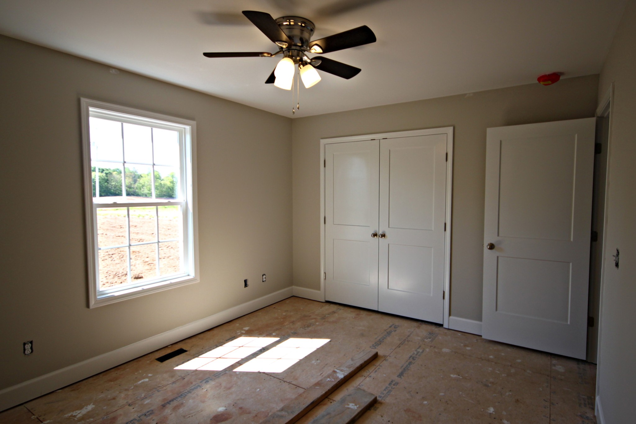 4118 Dot Road Springfield, TN 37172 - Photo 12 of 14 a view of an empty room and window and a ceiling fan