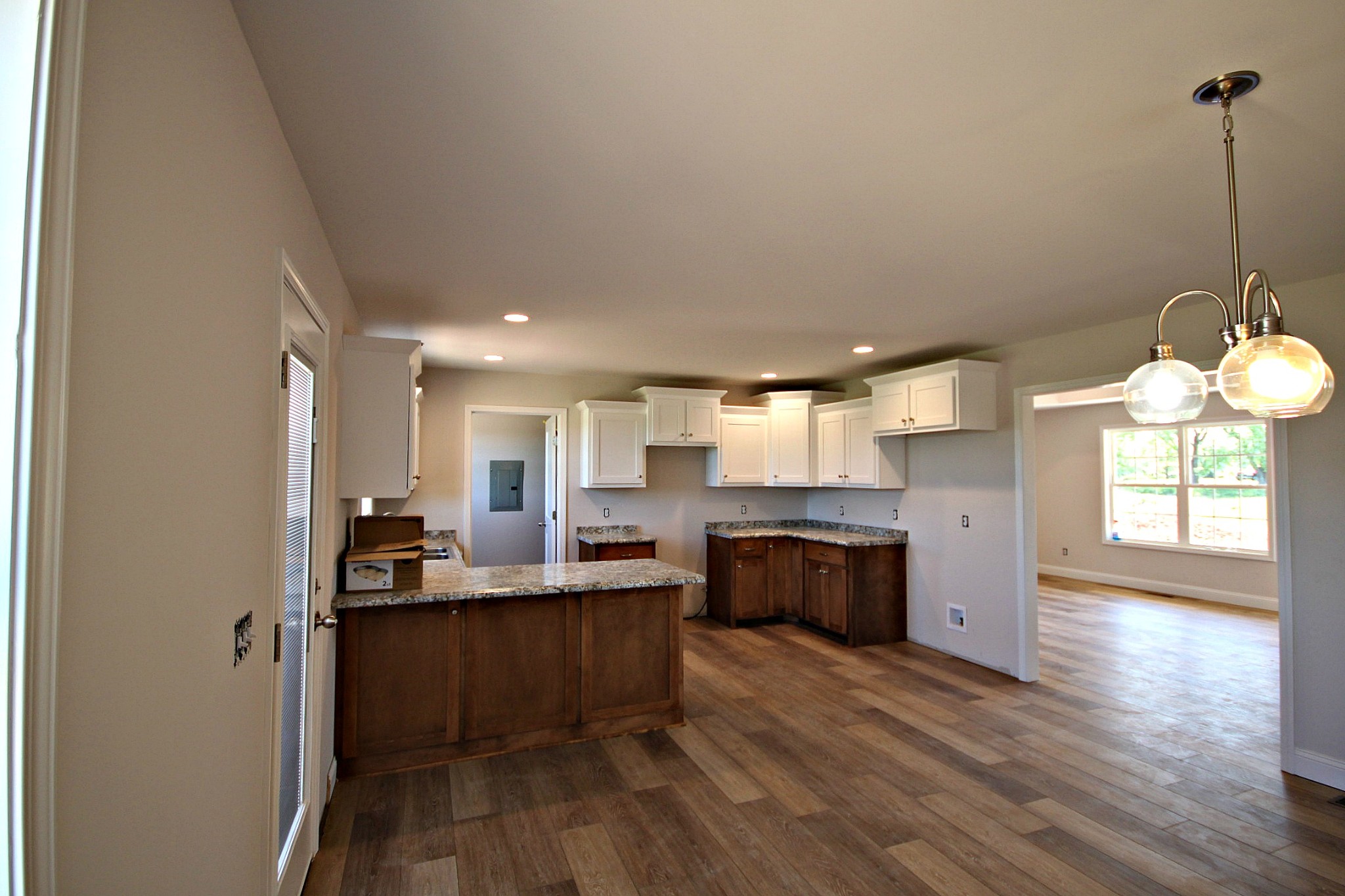 4118 Dot Road Springfield, TN 37172 - Photo 6 of 14 a kitchen with stainless steel appliances kitchen island granite countertop a sink dishwasher a stove and a refrigerator with wooden floor