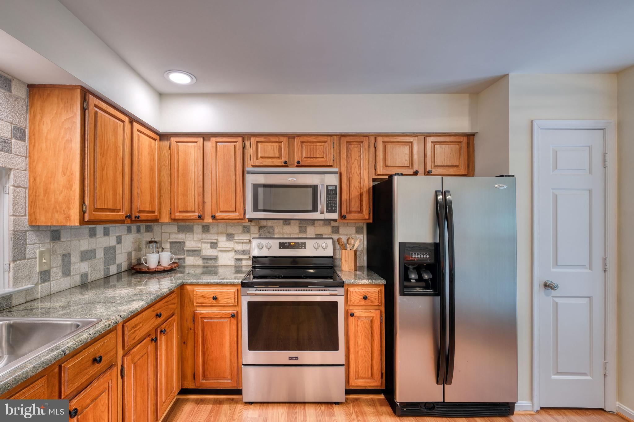 8174 Cliffview Avenue Springfield, VA 22153 - Photo 8 of 55 Stainless appliances and granite counters