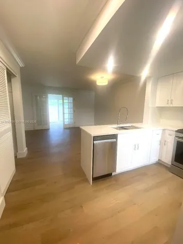 a view of a kitchen with a sink
