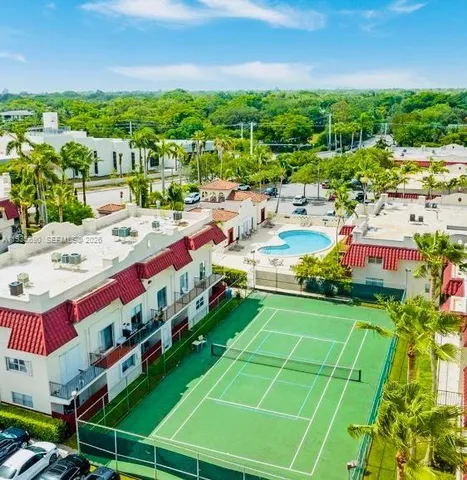 a view of a park with large trees