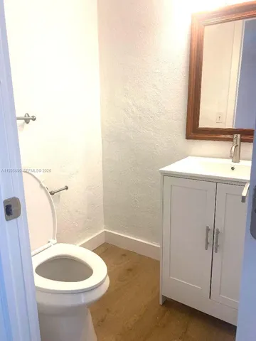 a bathroom with a sink a toilet and tub