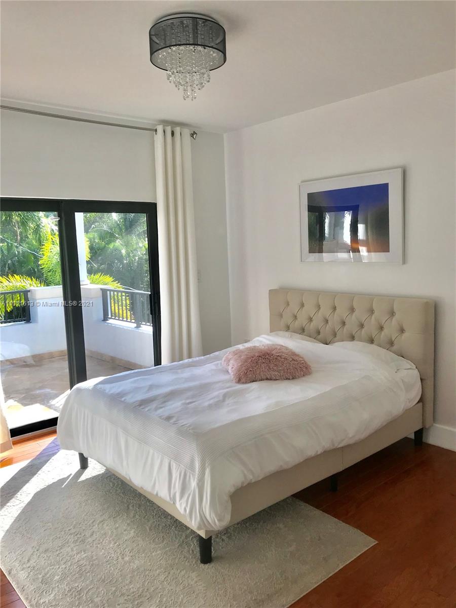 471 Southwest 30th Road Miami, FL 33129 - Photo 13 of 27 3rd Bedroom | Wood Flooring | 2nd floor Balcony access with view to the Pool/Garden
