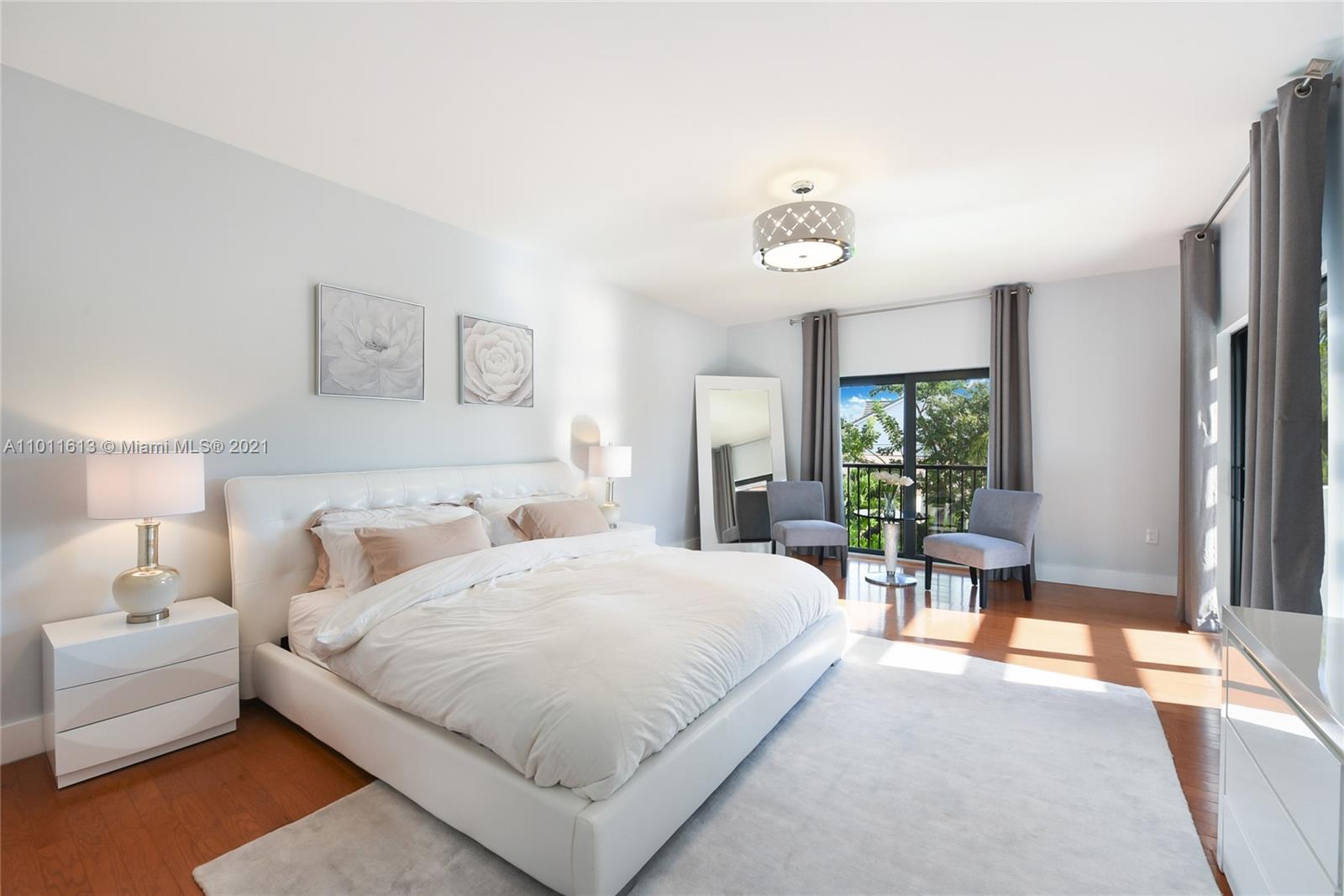 471 Southwest 30th Road Miami, FL 33129 - Photo 19 of 27 4th Bedroom | Master Bedroom - 2nd Floor | Wood Flooring | Opens up to Large balcony that offers views to the Backyard/Pool area | Large Walk-in Closets | en-suite Master Bathroom