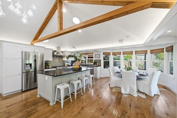 a kitchen with stainless steel appliances a refrigerator sink and stove