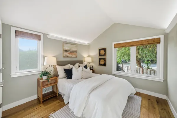 a bedroom with a bed and a couch